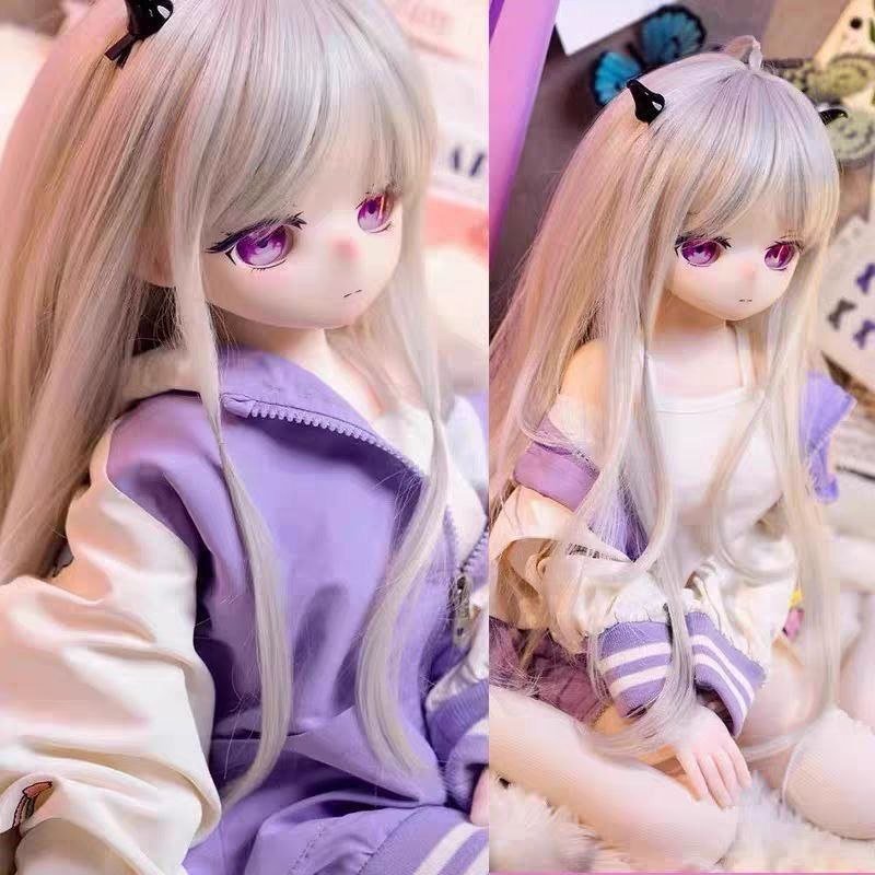 DD06585 Luna 68cm TPE anime doll side profile and sitting pose highlighting her delicate features Luna - 68cm Mini Anime TPE Doll with Articulated Skeleton, PVC Head, SKU: DD065 product image showing body appearance and material texture