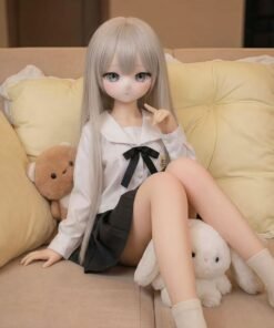 DD100 Yuki 68cm TPE anime doll sitting on a sofa, holding a plush bunny, highlighting her delicate features and outfit.