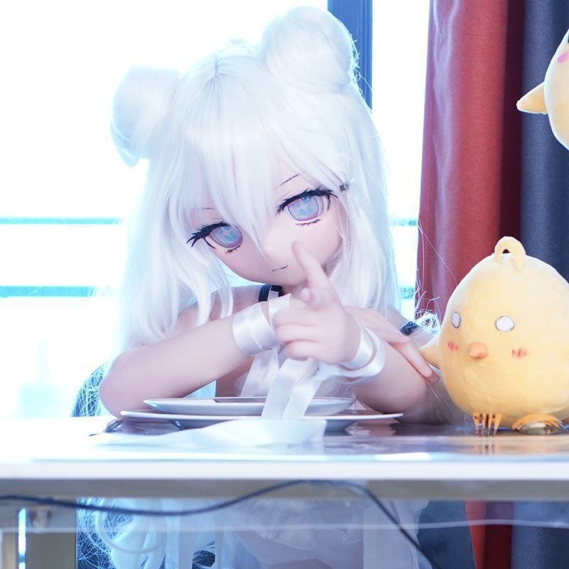 DD101 Luna 68cm TPE anime doll in a playful pose at a table with a cute chick toy Dd101 Luna Anime Tpe Figure with Articulated Skeleton Pvc Head 68cm Dd101 Luna 68cm Tpe Anime Doll in a Playful Pose at a Table with a Cute Chick Toy Dd101 Dd101 luna playful pose with chick toy