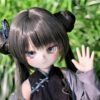 DD103 Mei 68cm TPE anime doll closeup of her face and hand waving in an outdoor setting DD103 Mei - TPE Anime Doll with Articulated Skeleton 68cm product image showing body appearance and material texture