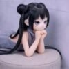 DD103 Mei 68cm TPE anime doll lying on a sofa, resting her chin on her hands.