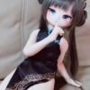 DD103 Mei 68cm TPE anime doll in a shushing pose on a sofa, wearing a qipao.
