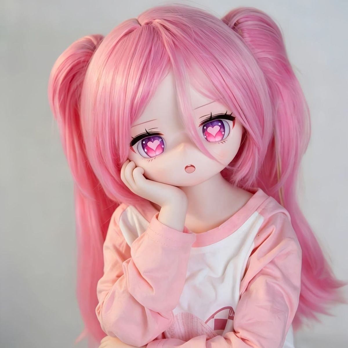 DD106 Luna 68cm TPE anime doll in a thoughtful pose highlighting her delicate features and pink hair Dd106 Luna Anime Tpe Doll with Articulated Skeleton 68cm Dd106 Luna 68cm Tpe Anime Doll in a Thoughtful Pose Highlighting Her Delicate Features and Pink Hair Dd106 Dd106 luna anime doll pose hand on chin pink hair