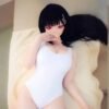 DD113 Ren 168cm full TPE realistic doll, close-up of face and upper body in white swimsuit, lying pose.