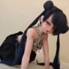 DD114 Yumi 168cm TPE body silicone head realistic doll in a playful kneeling pose with a black skirt DD114 Yumi - TPE Body + Silicone Head Realistic Doll 68cm product image showing body appearance and material texture